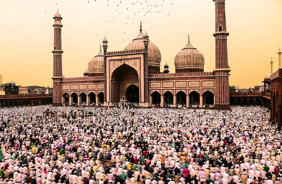 A large crowd gathers for prayer at the iconic Jama Masjid during Ramadan.