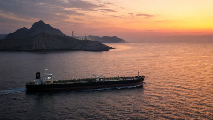 Crude oil tanker sailing through the Strait of Hormuz near Larak Island
