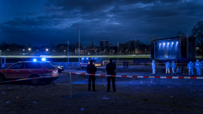 Swiss police vehicles outside the Schachen event grounds in Aarau after a night-time shooting