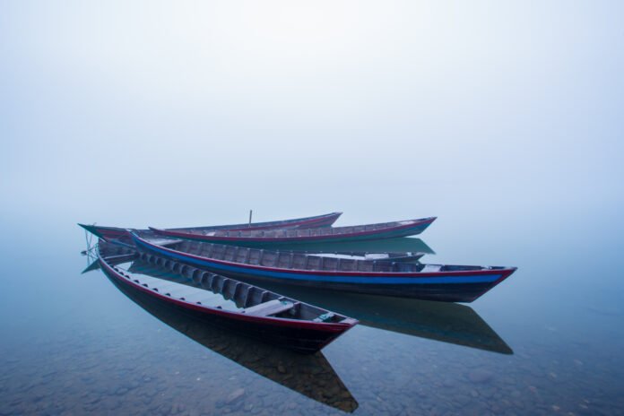 Wooden boats on the Kaladan River in Rakhine State, Myanmar