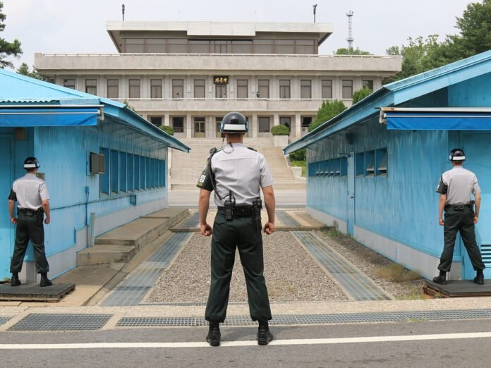 Soldiers at the Joint Security Area in the Korean DMZ South Korean soldiers standing guard at the Joint Security Area in Panmunjom on the Korean Demilitarized Zone