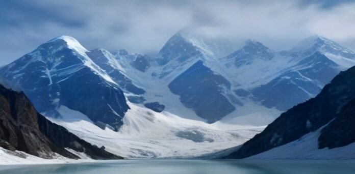 Turquoise glacial lake surrounded by snow-capped Himalayan peaks