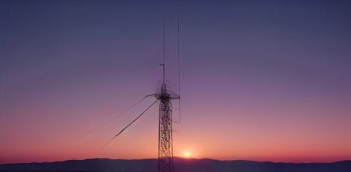 Military radar and communications tower installation at dusk, representing air defense operations