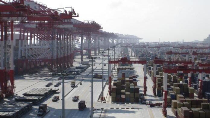 Containers at Yangshan Port, Shanghai Shipping containers and cranes at Yangshan deep-water port in Shanghai