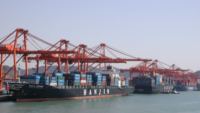 Busan Container Terminal — licensed file photograph Container ship and cargo cranes at Busan Container Terminal, South Korea