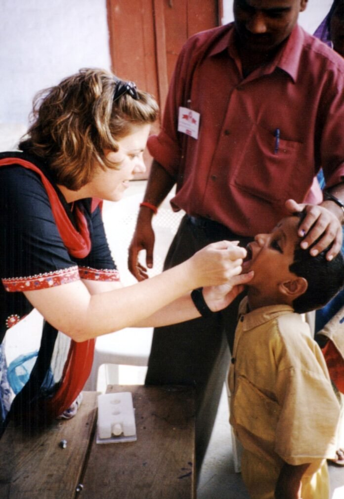Polio vaccination in India — CDC 2002 file photo A child receives oral polio vaccine during a 2002 immunisation campaign in India