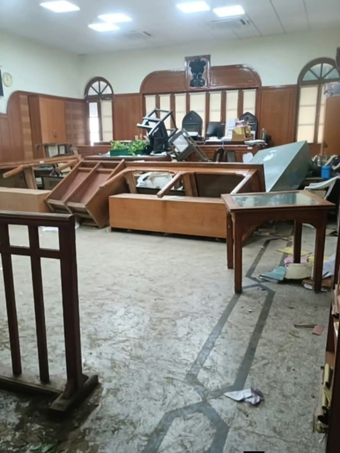 Overturned benches and chairs in a courtroom, in an image supplied by reporter Deepak Dube