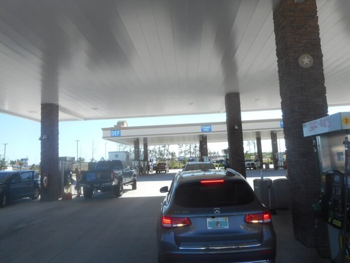 File photograph of vehicles at fuel pumps in Daytona Beach, Florida, in March 2023