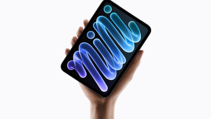 Apple launch photograph showing the new iPad mini held in a hand