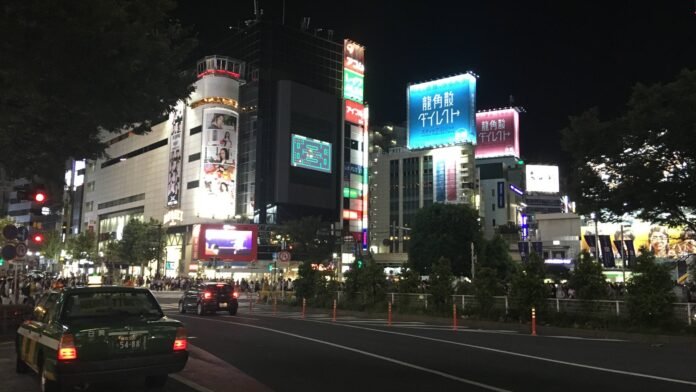 Shibuya Crossing and the surrounding streets in Tokyo at night — archival image, not the current event