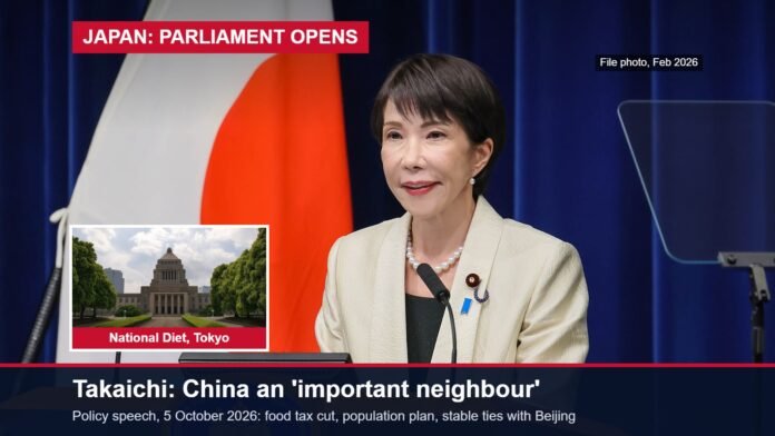 Japan's Prime Minister Sanae Takaichi at a podium, with an inset of the National Diet building in Tokyo